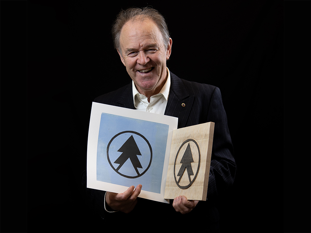 Finnskogen vagen till varldsarv Bigtail träsnitt logotyp